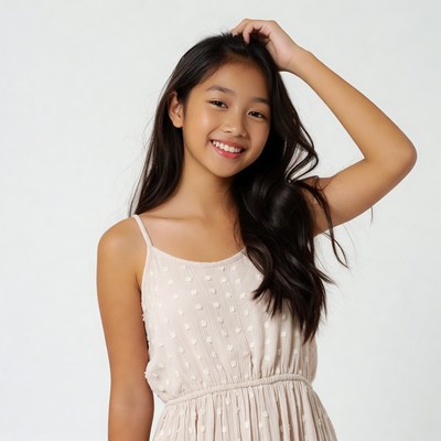 Asian girl smiling hand on head
