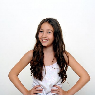 Smiling girl with hands on hips