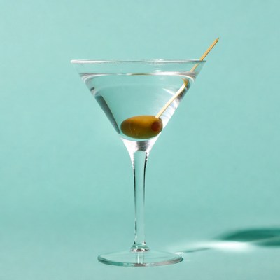 Martini with Olive on Blue Background