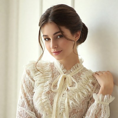 Woman in white lace blouse