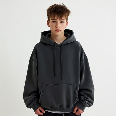 Teen boy in oversized gray hoodie