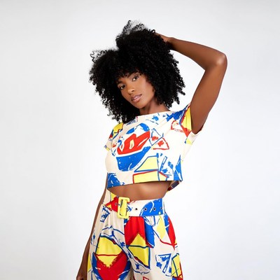 African-American woman in colorful geometric outfit