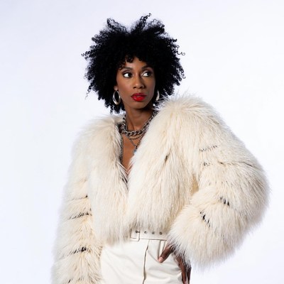 African-American woman in white fur coat