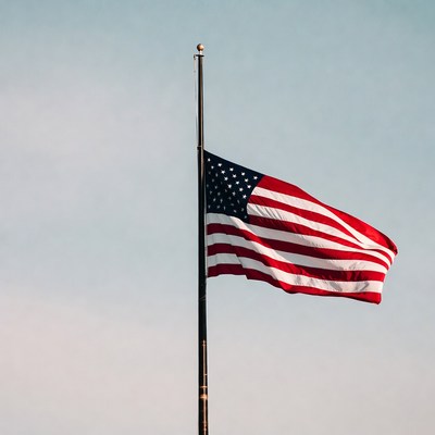 American Flag Waving on Pole