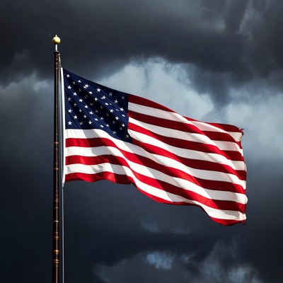 American flag waving in stormy sky