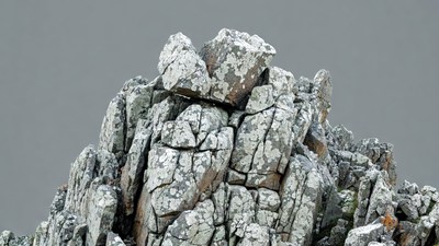 Rocky Mountain Peak on Gray Background