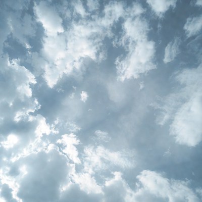 Fluffy white clouds in blue sky