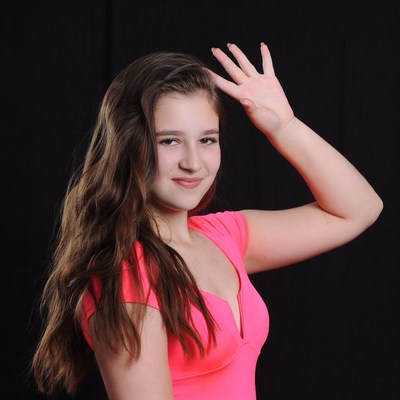 Teen girl making peace sign