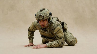 Soldier in camo gear crawling on ground