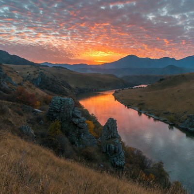 Sunset over river and mountains