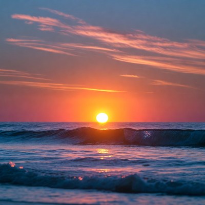 Sunset over ocean waves