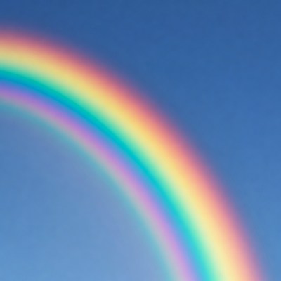 Vibrant Rainbow in Blue Sky