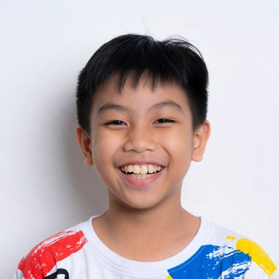 Asian boy smiling happily