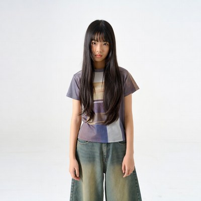 Asian girl in baggy jeans and striped shirt