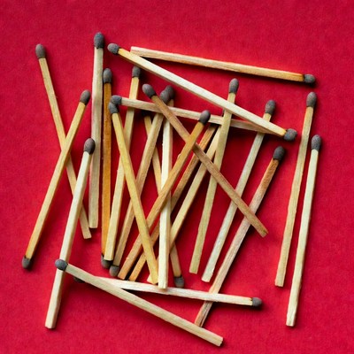 Matches scattered on red background