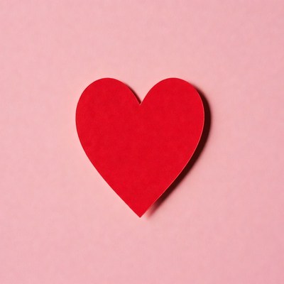 Red heart on pink background