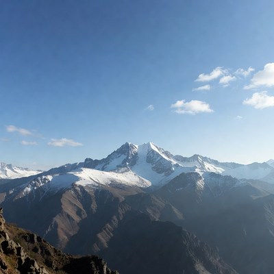 Snowy Mountain Peak under Blue Sky