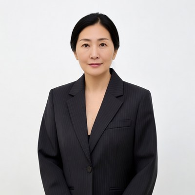 Asian woman in pinstripe suit
