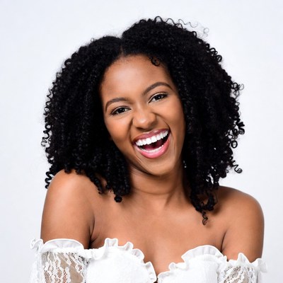 African-American woman laughing with curly hair