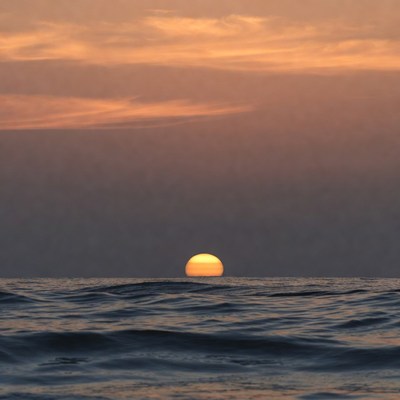 Sunset over ocean horizon