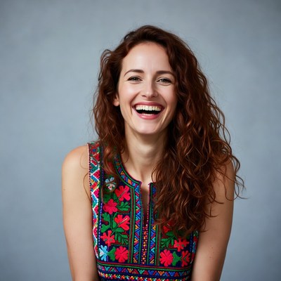 Smiling woman in colorful embroidered dress