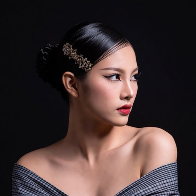 Asian woman with ornate hair clip