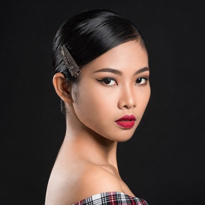 Asian woman with hair clip profile