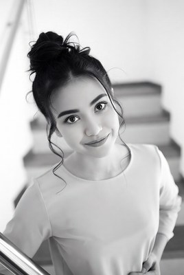 Asian woman smiling on stairs