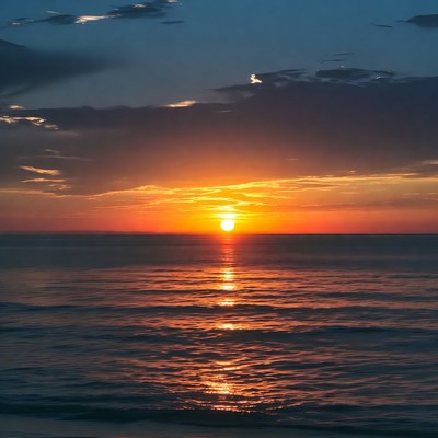 Sunset over ocean with reflection