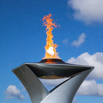 Olympic Torch Burning Against Blue Sky
