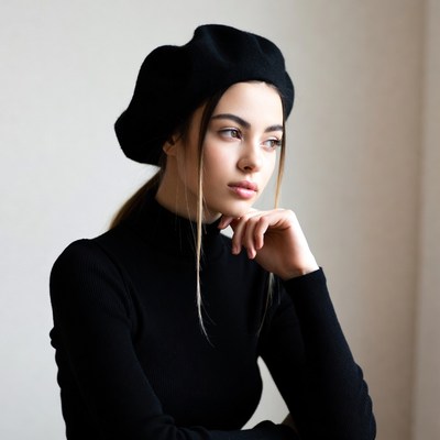Woman in black beret pondering