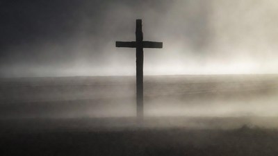 Wooden Cross in Foggy Field