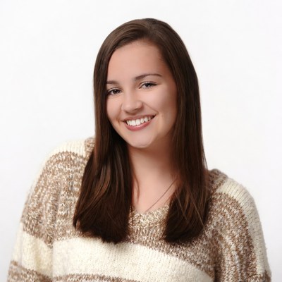 Smiling teenage girl in striped sweater