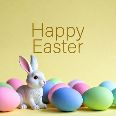 White bunny with colorful Easter eggs