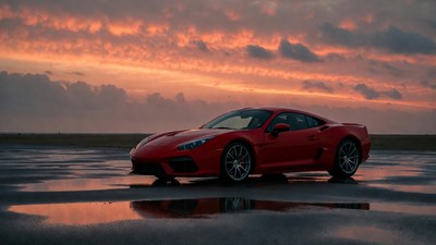 Red Supercar on Wet Road at Sunset