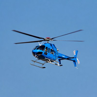 Blue helicopter flying in sky