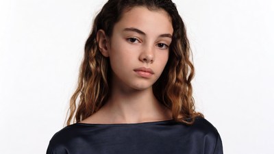 Teen girl with wavy brown hair