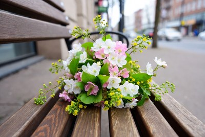 Bouquet of white pink flowers on bench