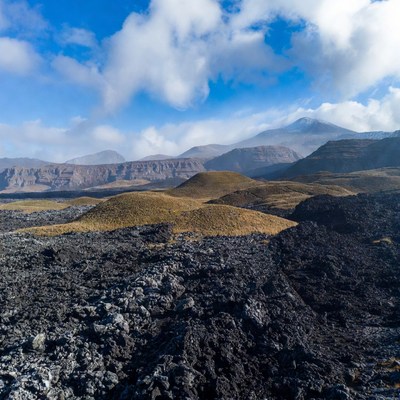 Volcanic Landscape with Mountains and Clouds