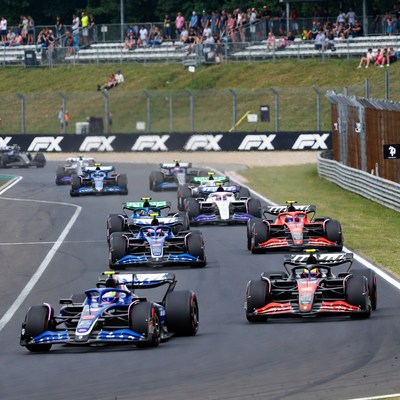 Formula 1 cars racing on track