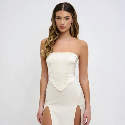 Woman in white satin corset dress