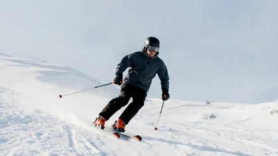 Man skiing down snowy slope