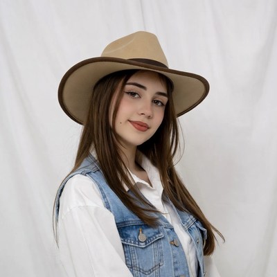 Girl wearing beige cowboy hat