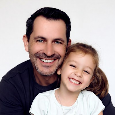 Father hugging smiling daughter