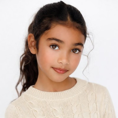 Young girl with ponytail smiling