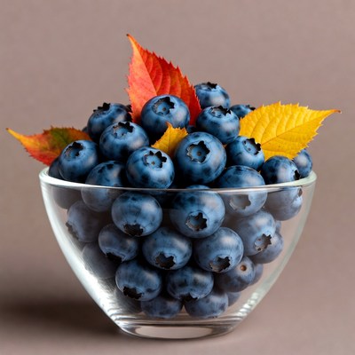 Blueberries in Glass Bowl with Autumn Leaves