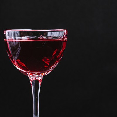 Red Wine Glass on Black Background