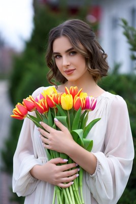 Woman holding colorful tulips