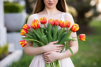 Woman holding red tulips
