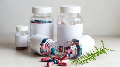 Spilled colorful pills from bottles